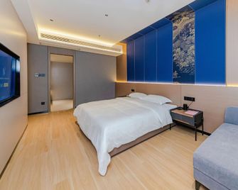 Xiyingmen Yongji Hotel (Shaoyang Xinshao Branch) - Shaoyang - Bedroom