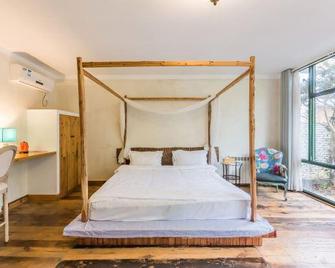 Moganshan Fuyaji Holiday Boutique Hostel - Huzhou - Bedroom