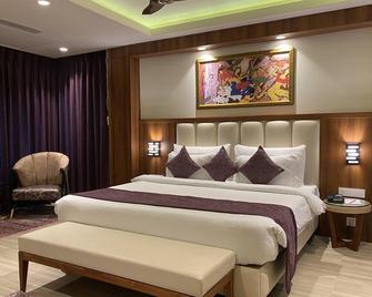 The Greenwood Resort, Guwahati - Gauhati - Schlafzimmer