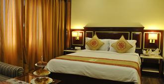 Dynasty Hotel - Guwahati - Kamar Tidur