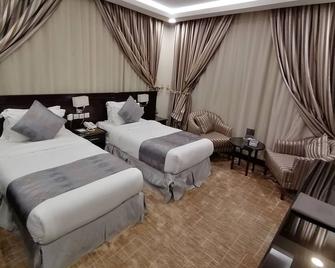 Almaali Hotel - Джазан - Спальня