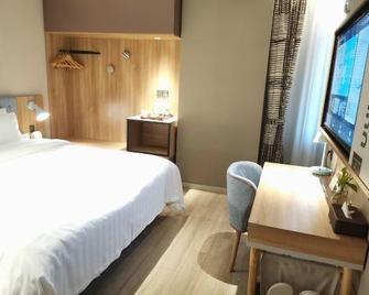 Mianzhu city in nanjing road commercial plaza store - Deyang - Bedroom