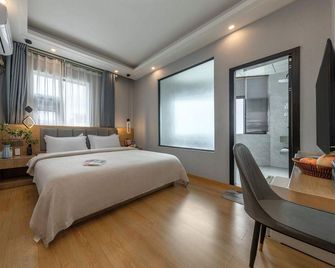 Zebulun Hotel - Lijiang - Schlafzimmer