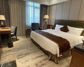 Wisconsin Spa Hotel - Tianjin - Schlafzimmer