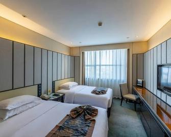 Xiangtan Jymgm Grand International Hotel - Xiangtan - Bedroom