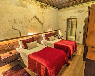 Mimi Cappadocia Luxury Cave Hotel - Uchisar - Спальня