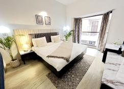 Bedchambers Serviced Apartments, Sector 40 - グルガウン - 寝室