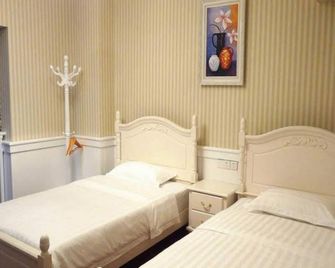 Nine Rooms Inn - Zhangjiajie - Makuuhuone