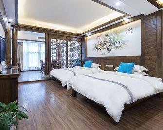 The Longmen One Inn - Zhangjiajie - Slaapkamer