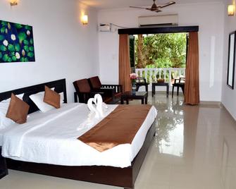 Naga Cottages - Morjim - Habitación