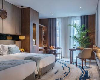 Yannian Plaza Hotel - Zhuzhou - Bedroom