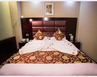 Dunhuang Silk Road Yiyuan Hotel - Jiuquan - Bedroom