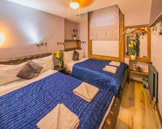 New Dawn Hotel - London - Schlafzimmer