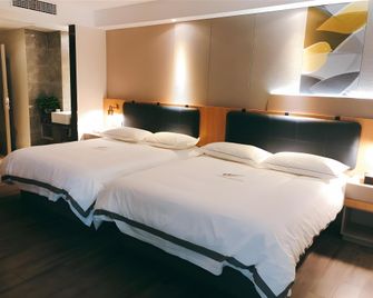 Jun Select Hotel Jiangsu Nanjing Jianye District Olympic Center - Nanjing - Slaapkamer