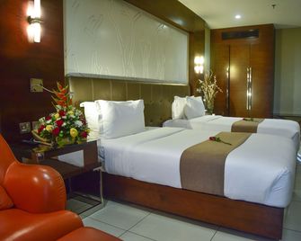 Harbour View Suites - Daressalam - Schlafzimmer