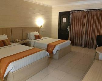 Hotel Mega Lestari - Balikpapan - Schlafzimmer