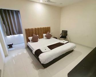 Hotel Rukmani Palace - Ujjain - Slaapkamer