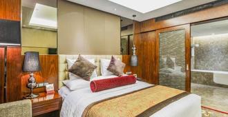 Jitang New Century Hotel - Tangshan - Schlafzimmer