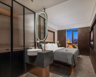 Nanyang Niannian Grapefruit Hotel (Nanhang Branch, Renmin Road) - Nanyang - Bedroom
