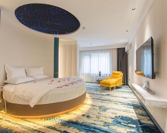 Zhongzhou Exquisite Hotel (Jiaozuo High-speed Railway Station Store) - Jiaozuo - Bedroom