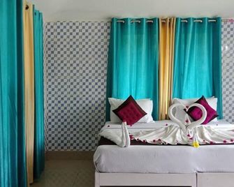 Daaven's Island Resort - פורי - חדר שינה