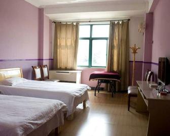 Zhuhui Hostel - Huzhou - Habitació