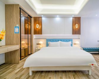 Wanning Xiangyu Hotel (Shenzhou Station Branch) - Wanning - Bedroom