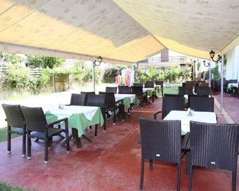 Porto Plazza Hotel - הרסוניסוס - מסעדה