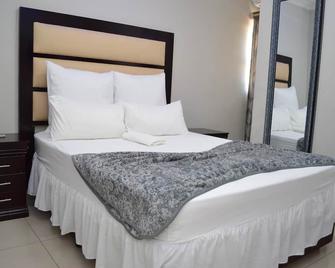 Emirates Garden Lodge - Boksburg - Schlafzimmer