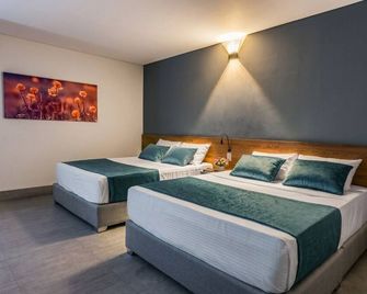 Hotel Rilux Barrancabermeja - Barrancabermeja - Schlafzimmer