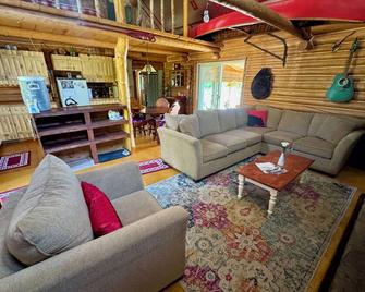 Experience True Solitude in this Gorgeous Wilderness Log Cabin - Cochrane - Living room