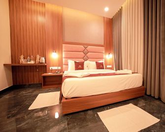 Lumarise Premium Wayanad Business Hotel - Sultan Bathery - Спальня