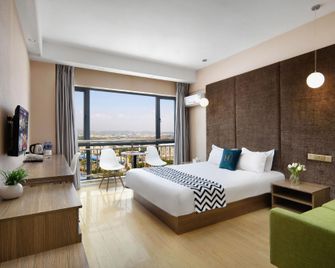 Ouye Boutique Hotel - Qujing - Habitación