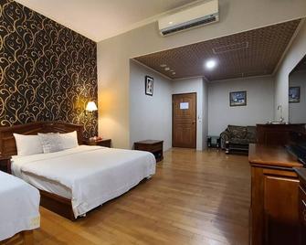 Di Bao Motel - Ji'an Township - Bedroom