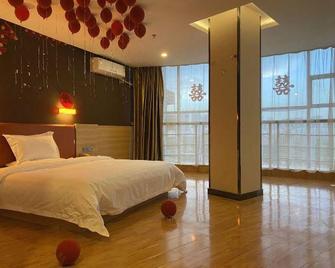 7 Days Premium Jiaozuo Renmin Road Teachers College - Jiaozuo - Slaapkamer