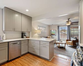 Elegant Escape Gourmet Kitchen and Outdoor Living - Austin - Kitchen