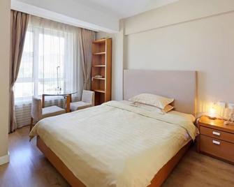 Dalian Zhongchen International Apartment - Dalian - Yatak Odası