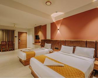 Hotel Beverly Plaza Kozhikode - Kozhikode - Bedroom