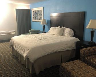 Executive Inn - Edmond - Спальня