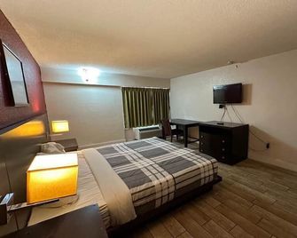 River Valley Inn & Suites (Extended Stay) - פורט סמית' - חדר שינה