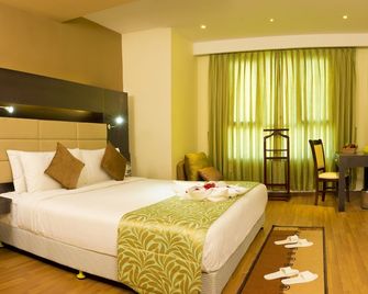 Poppys Hotel Madurai - מדוראי - חדר שינה