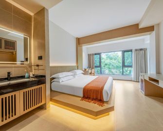 Jinghong Bugu Bird Hotel - Xishuangbanna - Schlafzimmer