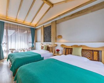 Lijiangyuan Hostel - Lijiang - Slaapkamer