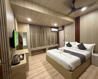 Hotel Alohi Grand - Gauhati - Schlafzimmer