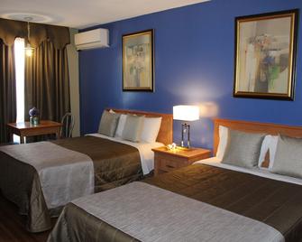 Hotel Motel Hospitalite - Levis - Yatak Odası