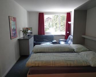 Face Aparthotel - Davos - Schlafzimmer