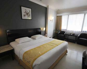 Hotel Banjarmasin International - Banjarmasin - Bedroom