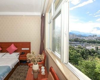 Weiduoli Hotel - Dali - Habitación