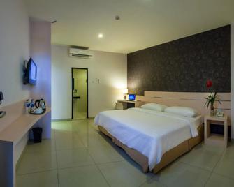 Cordela Hotel Medan - Medan - Bedroom