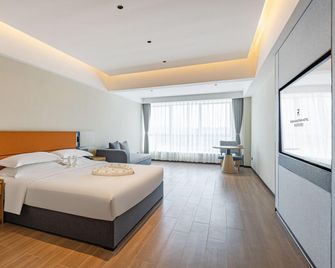 Rezen Kingtown Hotel - Wanning - Ložnice